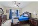 Spacious bedroom enhanced by a ceiling fan and brightened by natural light from its windows at 958 Denton Ct, Westfield, IN 46074