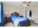 This bedroom has a ceiling fan, carpeted floors, and ample natural light from the windows at 958 Denton Ct, Westfield, IN 46074