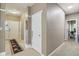 Bright hallway featuring neutral paint, overhead lighting, and access to various rooms at 958 Denton Ct, Westfield, IN 46074