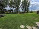 Expansive backyard featuring a trampoline, shed, and plenty of green space at 105 Cottonwood Dr, Maxwell, IN 46154