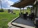 Cozy backyard patio with a gravel area, outdoor seating, and a fire pit at 105 Cottonwood Dr, Maxwell, IN 46154