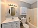 Cozy bathroom featuring a vanity, toilet, and a shower-tub combination with white fixtures at 10548 Magenta Dr, Noblesville, IN 46060
