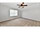 Bedroom with soft carpet, natural light from the window, and a contemporary ceiling fan at 10548 Magenta Dr, Noblesville, IN 46060