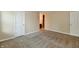 Neutral bedroom featuring carpet, white doors, and access to another room at 10548 Magenta Dr, Noblesville, IN 46060