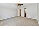 Cozy bedroom with soft carpet, ceiling fan, and access to an en-suite bathroom for added convenience at 10548 Magenta Dr, Noblesville, IN 46060