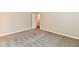 Bright and airy bedroom featuring neutral walls, plush carpeting, and an open doorway at 10548 Magenta Dr, Noblesville, IN 46060