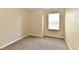 Serene bedroom with cozy carpet, window for natural light, and neutral decor at 10548 Magenta Dr, Noblesville, IN 46060