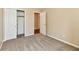 Comfortable bedroom featuring plush carpet, closet, and neutral wall paint at 10548 Magenta Dr, Noblesville, IN 46060