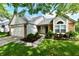 Charming single-story home with a well-manicured lawn and a brick-accented facade at 10548 Magenta Dr, Noblesville, IN 46060