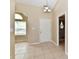 Welcoming foyer with tile flooring, leading to various rooms and a view to a window at 10548 Magenta Dr, Noblesville, IN 46060