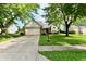 Inviting single-story home with a well-kept lawn, attached garage, and mature trees in a residential neighborhood at 10548 Magenta Dr, Noblesville, IN 46060