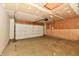 Spacious garage with an automatic door opener and unfinished walls and flooring at 10548 Magenta Dr, Noblesville, IN 46060