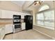 Bright kitchen featuring white cabinets, stainless steel appliances, and tiled flooring at 10548 Magenta Dr, Noblesville, IN 46060