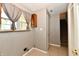 Laundry room with washer and dryer hookups, a storage cabinet, and tiled flooring at 10548 Magenta Dr, Noblesville, IN 46060
