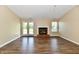 Bright living room with hardwood floors and a fireplace, perfect for relaxation at 10548 Magenta Dr, Noblesville, IN 46060
