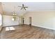 Well-lit living room with hardwood floors and seamless flow to the entryway at 10548 Magenta Dr, Noblesville, IN 46060
