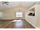Large living room with vaulted ceilings, a fan, and connecting to the kitchen area at 10548 Magenta Dr, Noblesville, IN 46060
