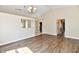 Spacious living room with hardwood floors and an open layout into the kitchen at 10548 Magenta Dr, Noblesville, IN 46060