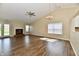 Spacious living room featuring vaulted ceilings, a fireplace, wood-look flooring and natural light at 10548 Magenta Dr, Noblesville, IN 46060