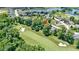 Breathtaking aerial shot of a golf community featuring lush greenery, sand traps, and luxurious homes at 10585 Golden Bear Way, Noblesville, IN 46060