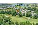 High angle view showcasing a scenic golf course community with a beautiful lake and stunning homes at 10585 Golden Bear Way, Noblesville, IN 46060