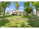 A perfectly manicured lawn surrounds the exterior of this home at 10585 Golden Bear Way, Noblesville, IN 46060