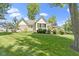 Picture of a well-manicured lawn and professional landscaping behind this home at 10585 Golden Bear Way, Noblesville, IN 46060