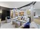 Spacious basement with columns, plush seating, and an entertainment center at 10585 Golden Bear Way, Noblesville, IN 46060