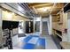 Finished basement with an exercise area, work space, and access to the stairs at 10585 Golden Bear Way, Noblesville, IN 46060