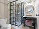 Stylish bathroom features a modern tiled shower, elegant vanity, and contemporary fixtures at 10585 Golden Bear Way, Noblesville, IN 46060