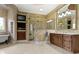 Elegant bathroom featuring a clawfoot tub, a walk-in shower, and a spacious vanity at 10585 Golden Bear Way, Noblesville, IN 46060