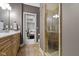 Bathroom featuring a glass shower, and view into the Main Bedroom at 10585 Golden Bear Way, Noblesville, IN 46060