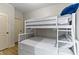 bedroom with a bunk bed and light colored walls at 10585 Golden Bear Way, Noblesville, IN 46060