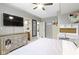 Relaxing bedroom with double bed, built-in desk, and ensuite access at 10585 Golden Bear Way, Noblesville, IN 46060