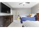 Inviting bedroom with two beds, ceiling fan, and neutral decor at 10585 Golden Bear Way, Noblesville, IN 46060
