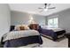 Cozy bedroom with two beds, soft lighting, and a large window at 10585 Golden Bear Way, Noblesville, IN 46060