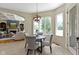 Cozy breakfast nook with ample natural light, a round table, and views of the outdoors at 10585 Golden Bear Way, Noblesville, IN 46060