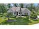 Charming stone home with a well-manicured lawn and beautiful landscaping at 10585 Golden Bear Way, Noblesville, IN 46060