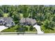 Charming single-story home featuring mature trees, lush landscaping, and a three-car garage at 10585 Golden Bear Way, Noblesville, IN 46060