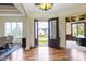 A grand foyer featuring hardwood floors, elegant lighting, and an open floor plan at 10585 Golden Bear Way, Noblesville, IN 46060
