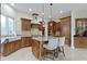 Well-equipped kitchen featuring custom cabinetry, a center island, and modern stainless steel appliances at 10585 Golden Bear Way, Noblesville, IN 46060