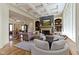 Comfortable living room with a fireplace, custom built-ins, and open floor plan at 10585 Golden Bear Way, Noblesville, IN 46060