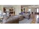 Open-concept living room flows into the kitchen with a cozy seating area and stylish decor at 10585 Golden Bear Way, Noblesville, IN 46060