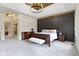 Spacious main bedroom featuring tray ceilings, wood accents, and plush carpet at 10585 Golden Bear Way, Noblesville, IN 46060