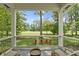 Inviting porch overlooking expansive green lawn with a charming outdoor seating area at 10585 Golden Bear Way, Noblesville, IN 46060