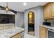 Access a beautiful wine cellar from this stunning basement bar area at 10585 Golden Bear Way, Noblesville, IN 46060