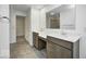 Elegant bathroom with dual vanities, granite counters, and tiled flooring at 1073 E Valley Oak Ct, Mooresville, IN 46158