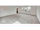 Spacious bedroom with large windows, neutral carpet, and en suite bathroom at 1073 E Valley Oak Ct, Mooresville, IN 46158