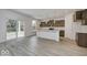 Open concept kitchen with sliding glass doors, creating a light-filled cooking and dining space at 1073 E Valley Oak Ct, Mooresville, IN 46158