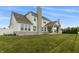 Expansive backyard featuring a covered patio and lush green lawn, perfect for outdoor activities and relaxation at 10795 Creekbed Cir, Fishers, IN 46038